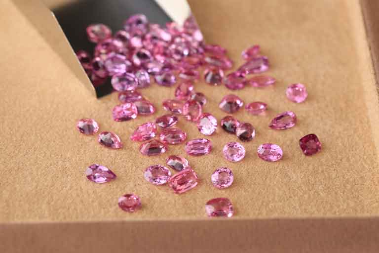 collection of pink colored gems